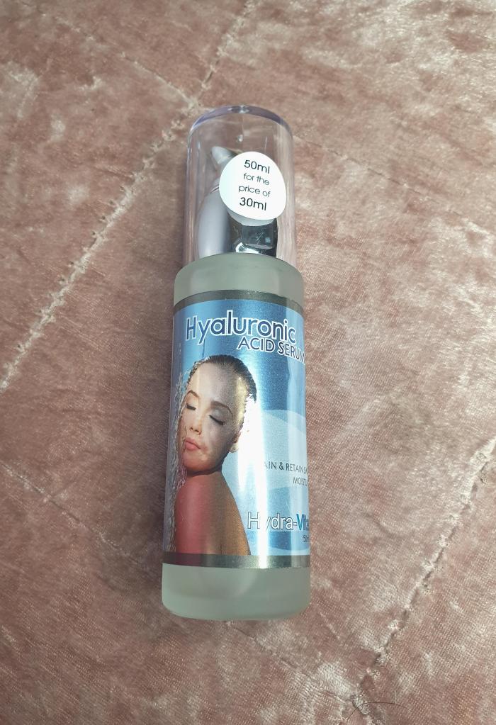 Hyra-Vital Hyaluronic Acid Serum Bottle flatlay.