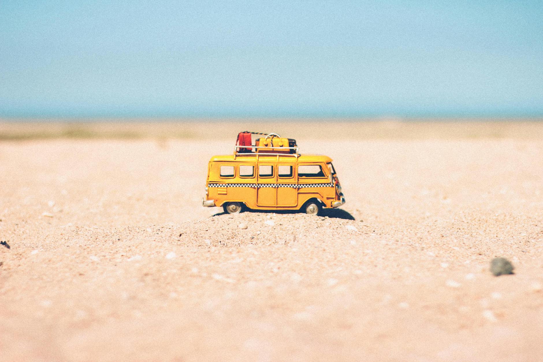 camper toy on the beach for creating lasting memories:essential tips for travelling with kids post.