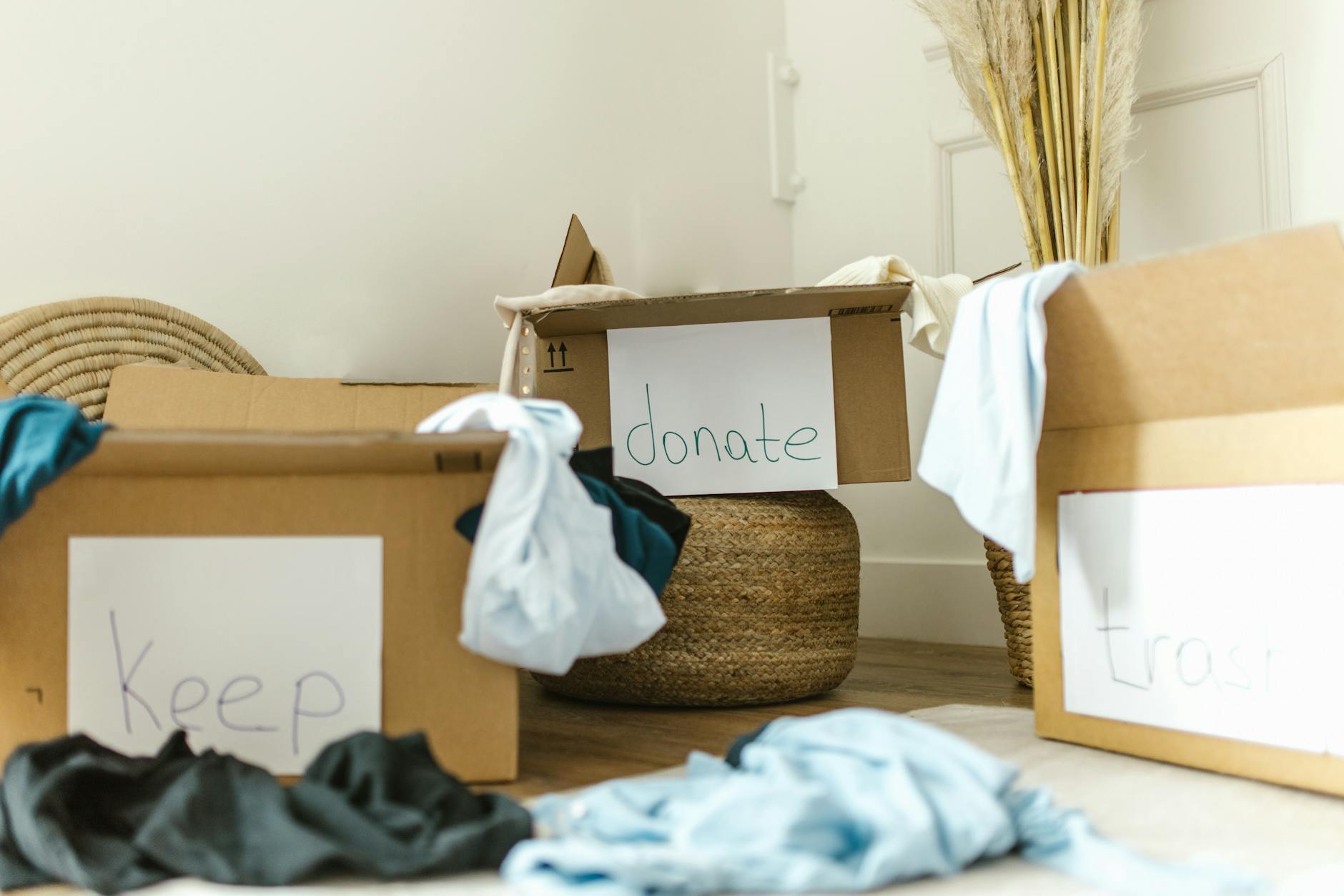 Boxes labelled keep and donate for Psychological Benefits of Decluttering in January post