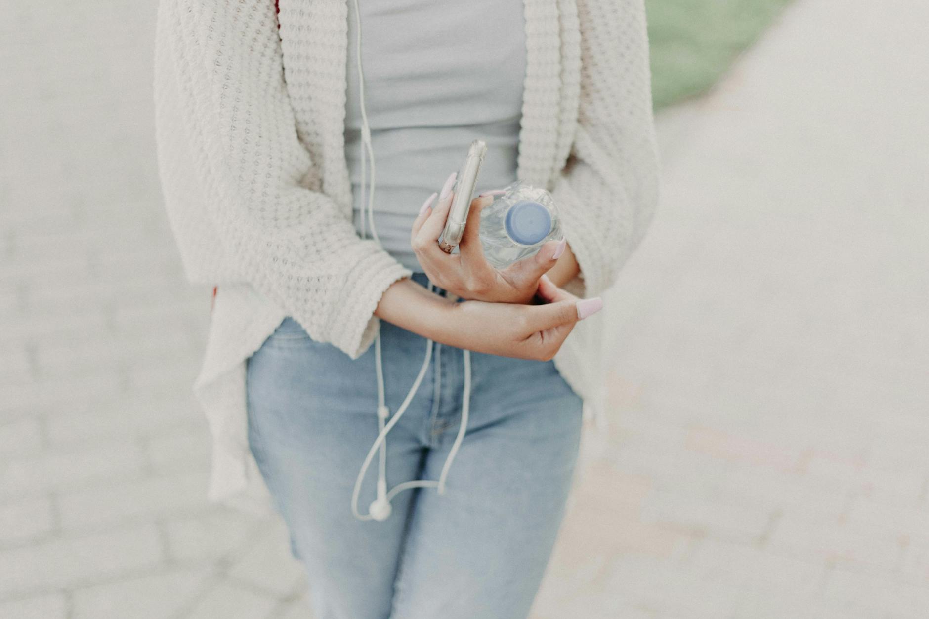 Woman holding a water bottle for Tips for a healthier Lifestyle: Simple, Sustainable Changes That Actually Last post.