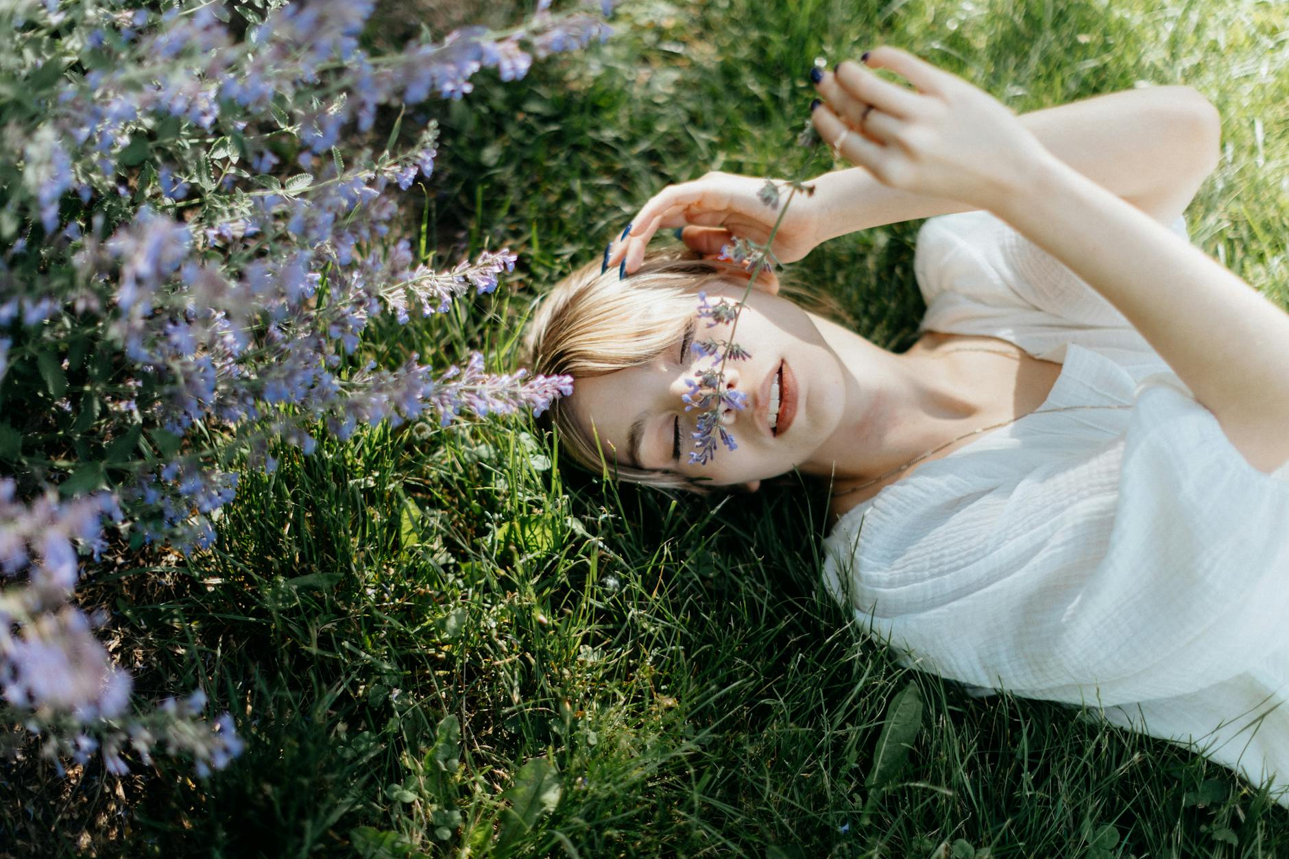 Women laying on the grass surrounded by flowers forHow I Organise My Home for a Stress-Free Spring (Simple, Realistic & Family-Friendly) post.