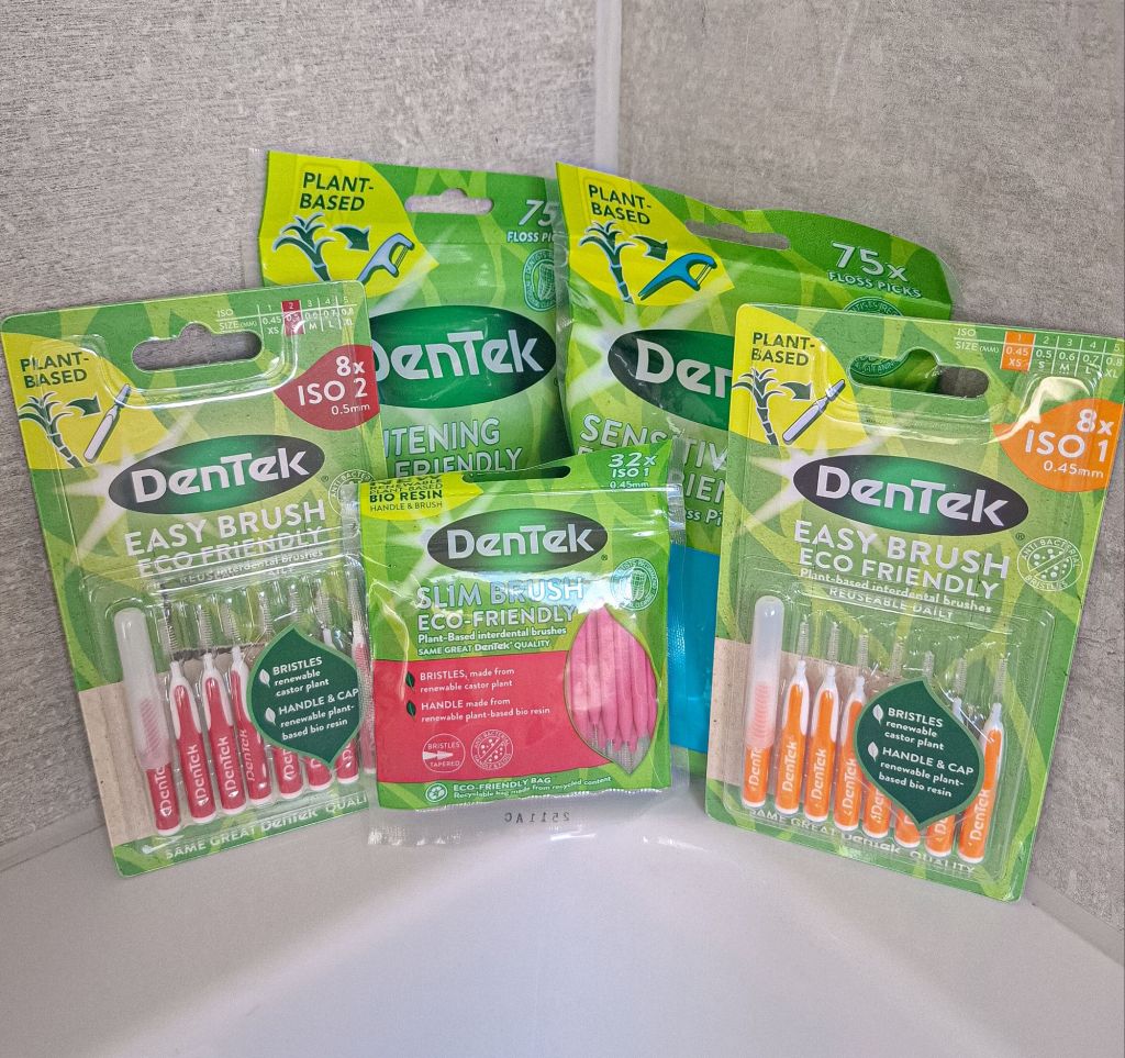 DenTek oral hygene products displayed in bathroom for Eco-Friendly Swaps That Are Worth It (And Ones That Aren’t) post.