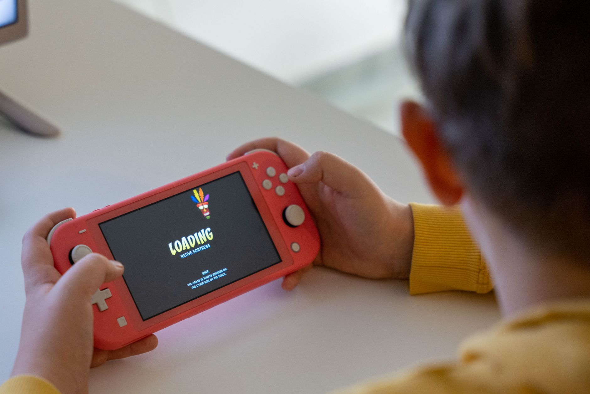 Child holding a switch for Managing Screen Time in Winter: Realistic Ideas for the Whole Family post.